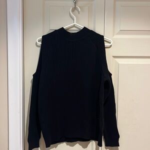 Black long sleeve sweater with slits in the arms. Slight turtleneck appearance.